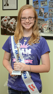 breanna-carr-nam-elgin-review-2014_1429 Breanna Carr is pictured with her sash, t-shirt, bracelet and necklace that she wore throughout most of the weekend. She was a state finalist at May’s 2015 Miss Nebraska Junior Teen Pageant in Omaha. E- R photo
