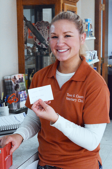 turkeydrawing_4836 Kari Schindler draws the winning name this afternoon at Town & Country Vet Clinic.