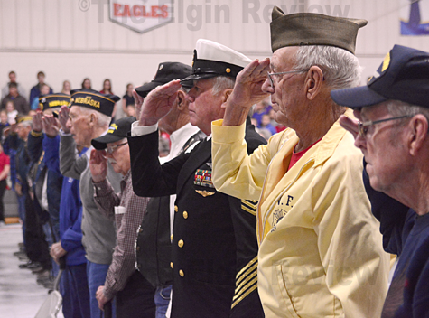 veterans-day_3805 Veterans in attendance salute the flag. The Elgin Review