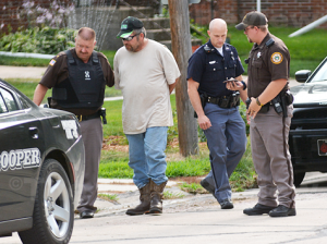 stacy-colman-arrest_6626-elgin-review Antelope County Sheriff Bob Moore leads Stacy Colman to a Nebraska State Patrol car following his arrest on Wednesday for violations of the Sex Offender Registry Act. Sheriff Moore and Deputy Timothy Schultz (far right) were assisted by the two members of the Nebraska State Patrol. Elgin Review photo