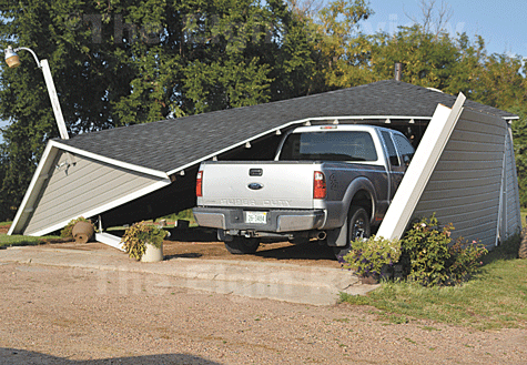 meis-garage-wind-damage-elgin-review A garage belonging to Ben and Anna Meis was demolished in the brief but powerful storm. The Elgin Review
